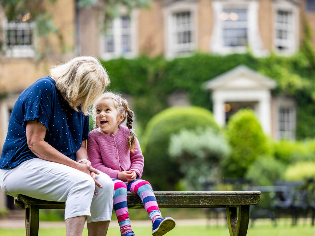 girl sitting with her teacher