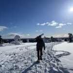 person walking through snow