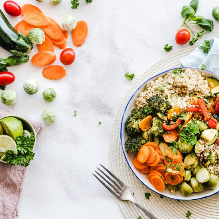 bowl of cous cous and vegetables on a countertop