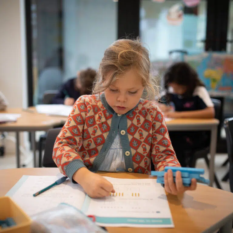 a little girl in class