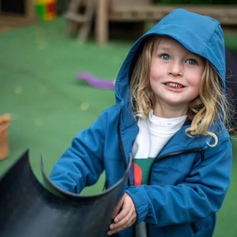 student in a raincoat