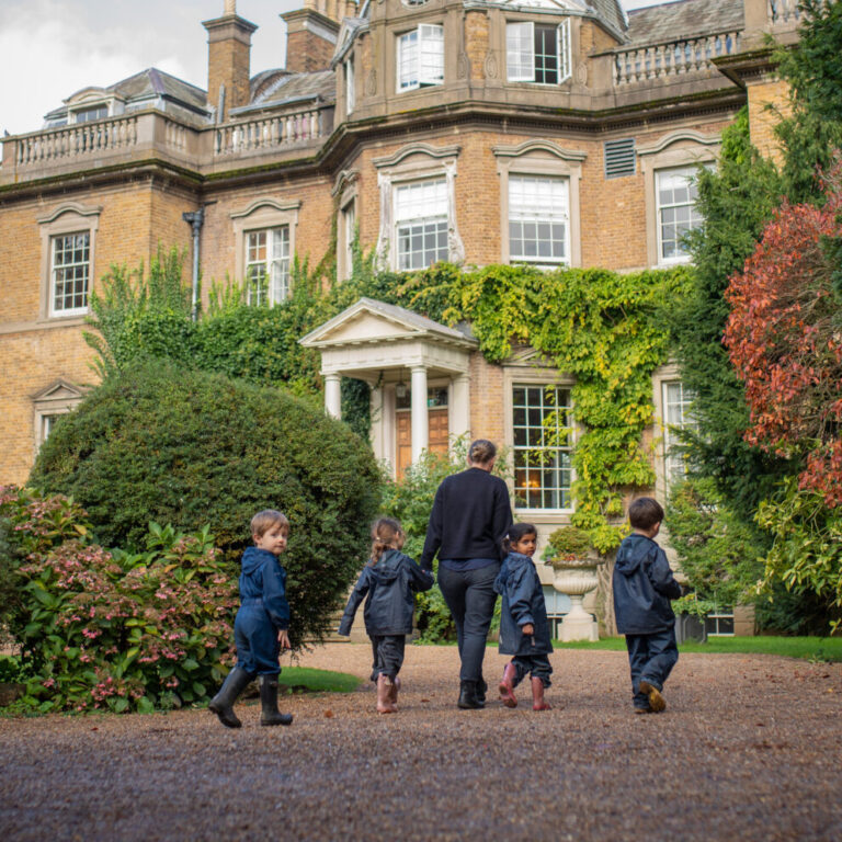 students on a walk with their teacher